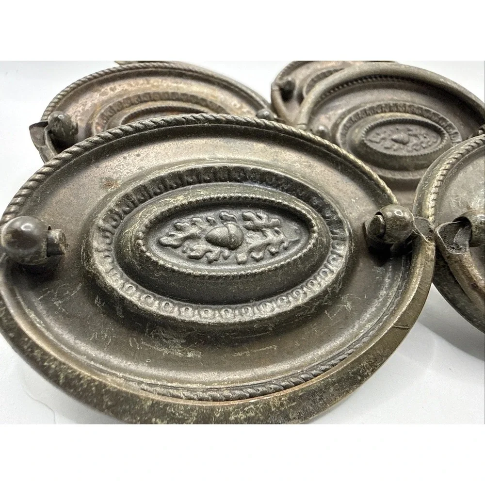 Antique Hepplewhite-style drawer pulls embossed oval backplate